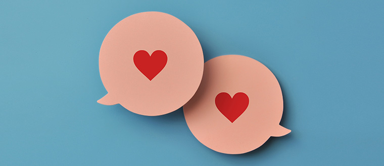 two conversation bubbles with hearts