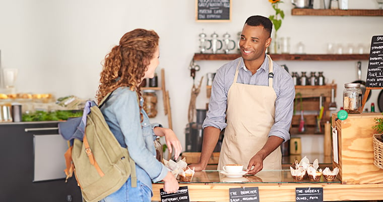 coffee shop barista helping a customer