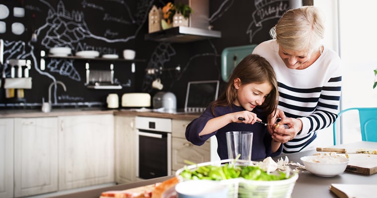 Grandma and grandaughter cooking in the kitchen