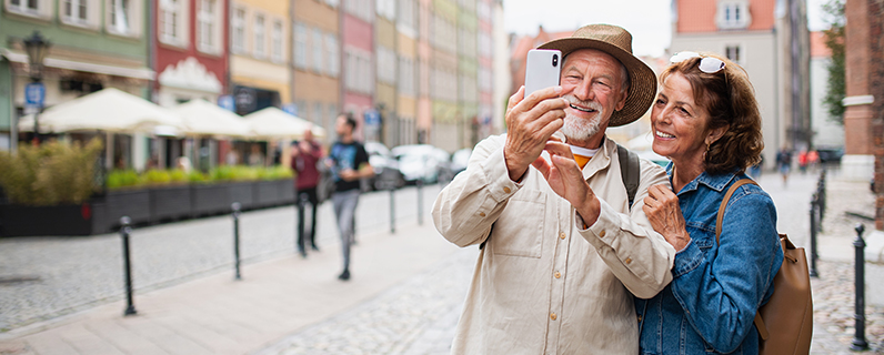 Older couple on vacation taking a selfie